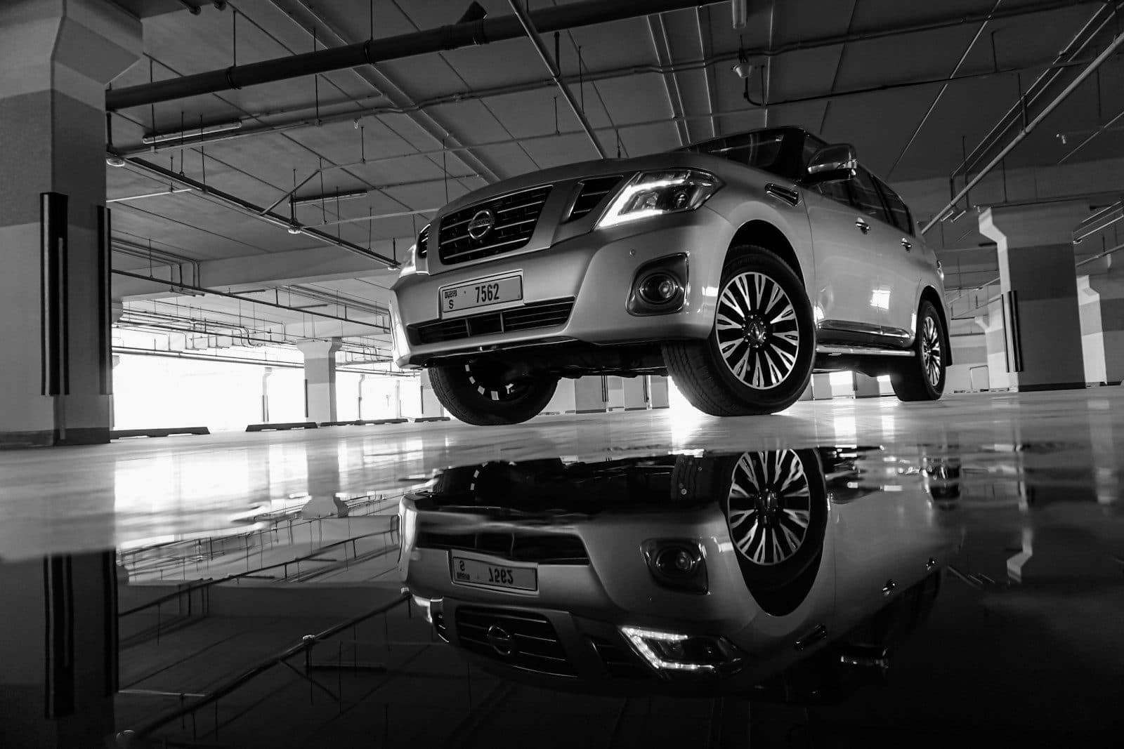 A Nissan Patrol inside a dark garage, the kind of car MIK Garage is trusted with